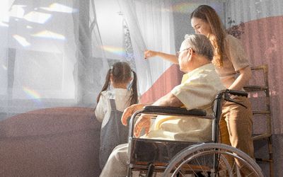 Woman helping elder relative look out the window