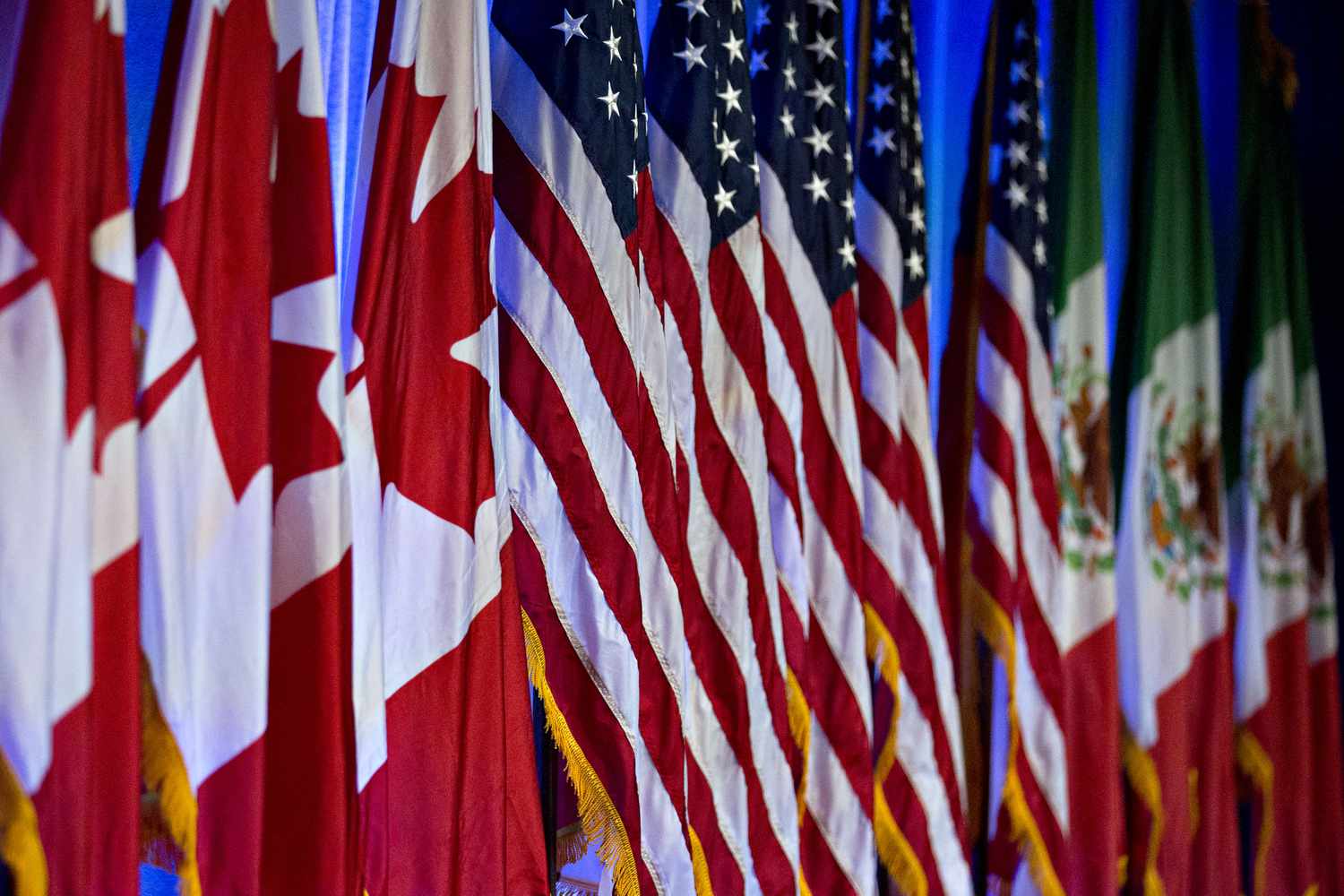 Canadian, American and Mexican flags stand on stage ahead of the first round of North American Free Trade Agreement (NAFTA) renegotiations in Washington, D.C., U.S., on Wednesday, Aug. 16, 2017.